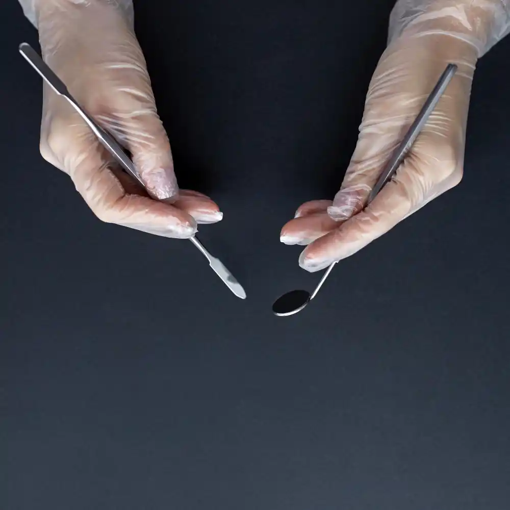 dental tools being held