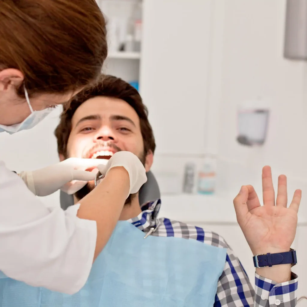 young happy man in dental examination